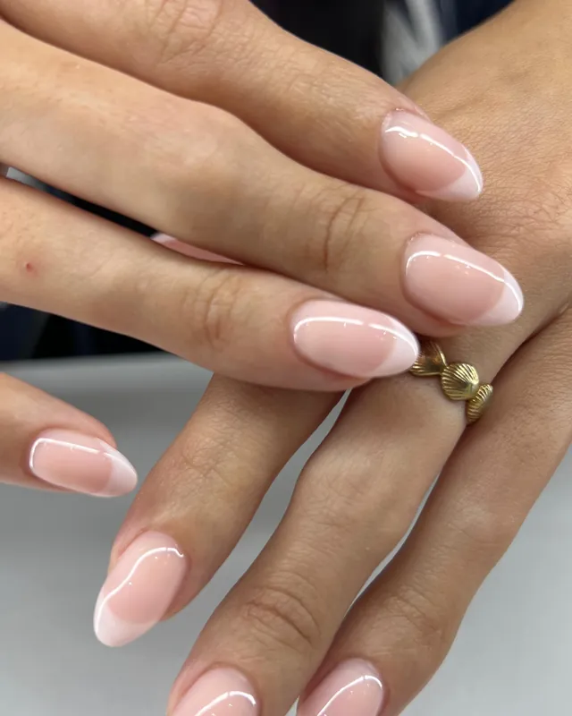 Milky pink almond nails with white French tips